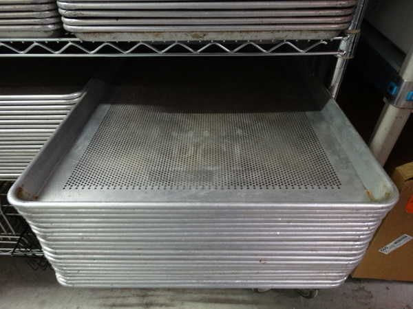 4 Metal Full Size Perforated Baking Pans. 18x26x1. 4 Times Your Bid!