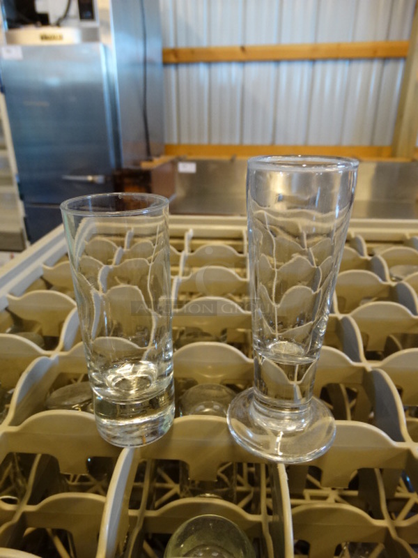 26 Beverage Glasses; Tall Shot And Footed in Dish Caddy. 1.5x1.5x4, 2x2x4.5. 26 Times Your Bid!