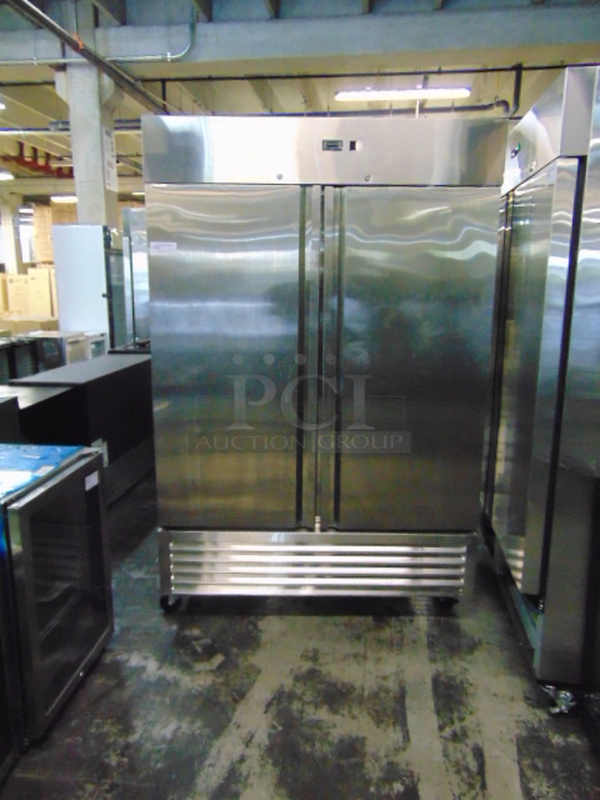 GORGEOUS! SG Merchandising Model DD49-SDSS Commercial Stainless Steel Electric Double Door Freezer On Commercial Casters. 115 Volt 54x32x83 Tested And Working.