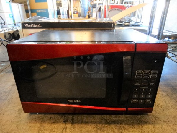 IN ORIGINAL BOX! West Bend Red and Black Countertop Microwave Oven. 