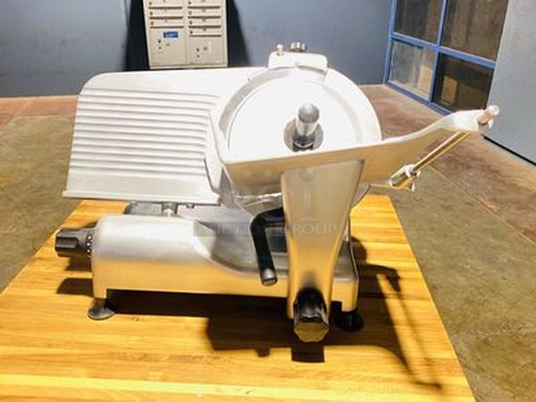 AWESOME!! New Globe G12 12" Manual Gravity Feed Slicer - 1/2 hp. 3 Amps 60 Hertz 1 Phase 115 Volts 345 Watts DON'T MISS THIS!! Tested. Turns On & Works Perfectly!! GLOBE G12 SPECS Width 22 1/4 Inches Depth 19 1/4 Inches Height 17 Inches Maximum Product Width 10 Inches Maximum Product Height 10 1/4 Inches Blade Size 12 Inches Horsepower 1/2 HP Installation Type Countertop Operation Manual Power Type Electric Slice Size 9/16 Inches Slicer Usage Mid Tier Slices Cheese Yes