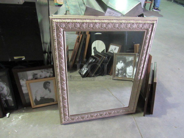 One 28X34 Framed Mirror.