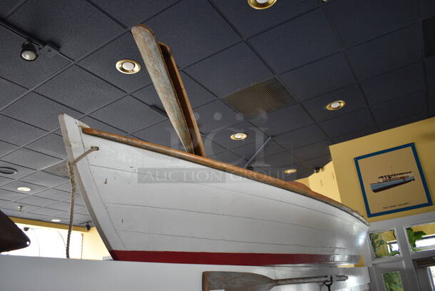 White Decorative Boat w/ 2 Oars. BUYER MUST REMOVE. 137"