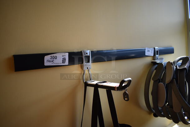 Black Wall Mount Rack. Does Not Come w/ Contents. BUYER MUST REMOVE. 48". (ballet room - upstairs)