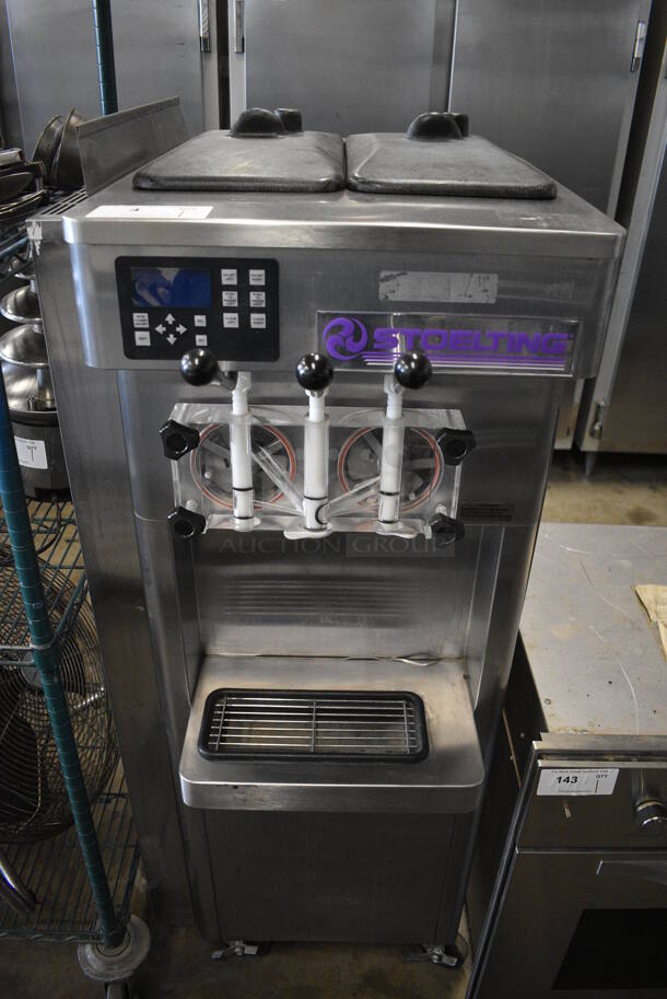 BEAUTIFUL! 2011 Stoelting Model F231-38I2 Stainless Steel Commercial Floor Style Air Cooled 2 Flavor w/ Twist Soft Serve Ice Cream Machine on Commercial Casters. 208-240 Volts, 1 Phase. 22x34x55