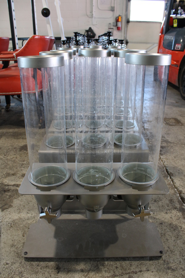 2 Gray Metal Topping Dispensers w/ 3 Poly Clear Chutes. Missing 1 Lid, 1 Knob and 1 White Poly Insert. 20x9.5x26. 2 Times Your Bid!