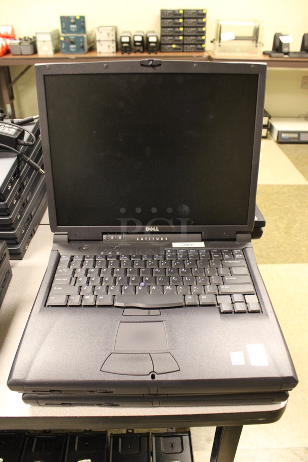 4 Dell Model PP01X Latitude 15" Laptops. 13x11x2. 4 Times Your Bid! (Room 105)