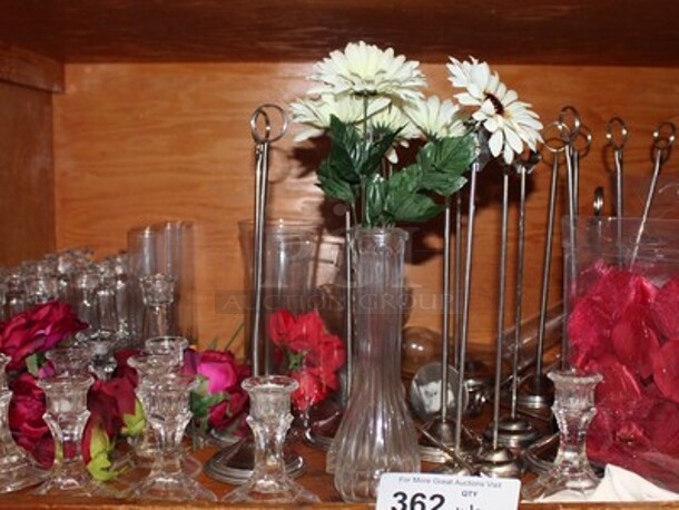 ALL ONE MONEY! Lot Includes Various Sized Vases, Fake Flowers, Table Number Holders, and Candle Holders. Winning Bidder Can Take What They Want From Lot!