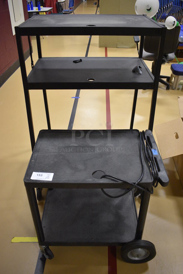 2 Various Black Carts on Casters. 32.5x27.5x48, 27x22x25.5. 2 Times Your Bid! (Chipperfield Elementary Gym)