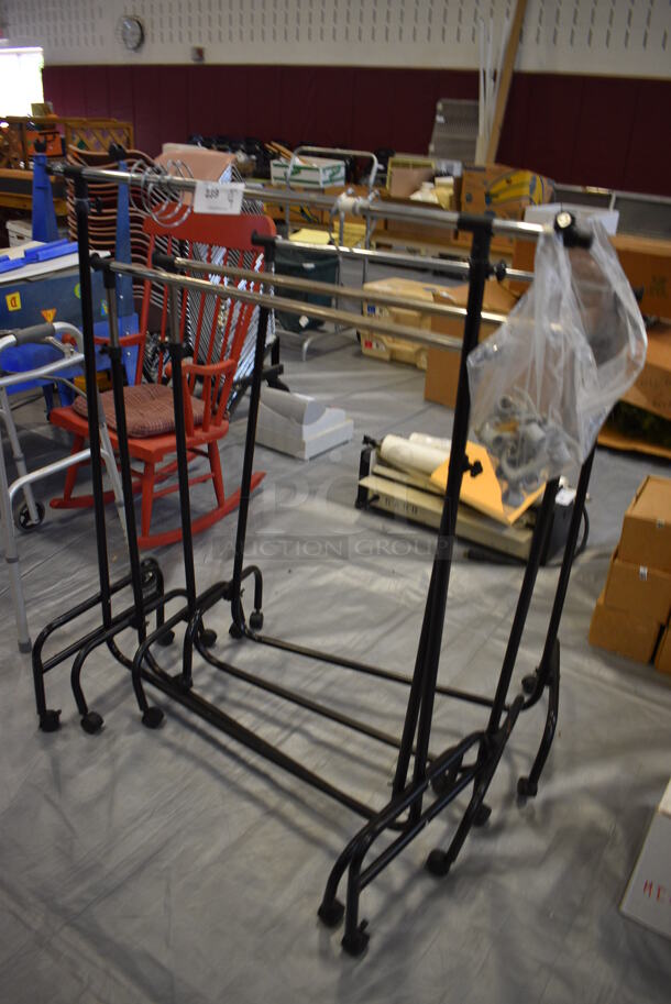 4 Metal Racks on Casters. Includes 37x17x50. 4 Times Your Bid! (Middle School Gym)