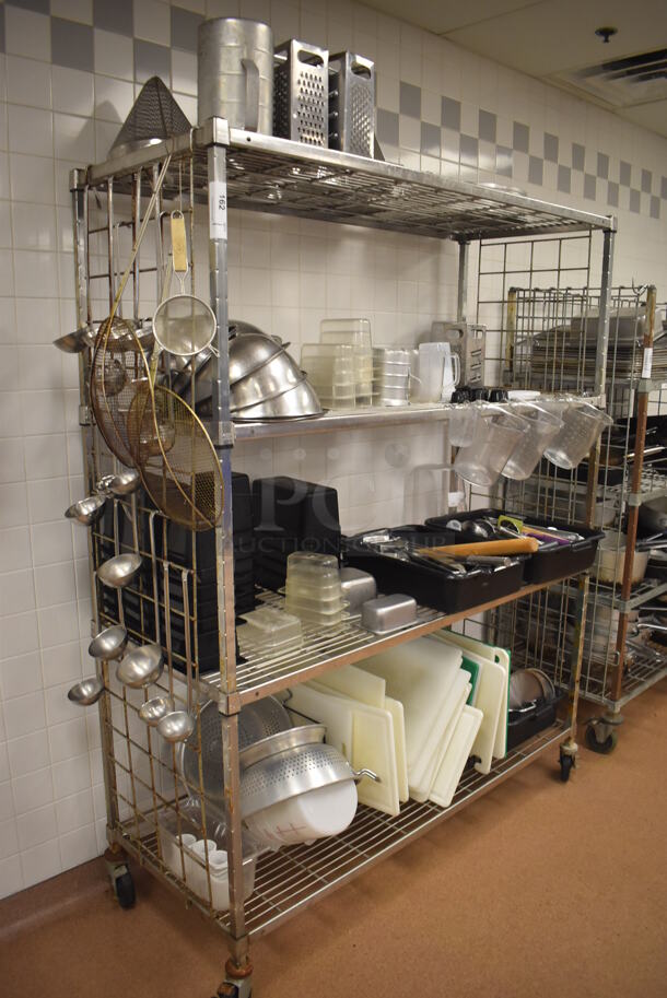 Metal 4 Tier Wire Shelving Unit w/ Contents Including Utensils, Poly Drop In Bins and Cutting Boards on Commercial Casters. BUYER MUST DISMANTLE. PCI CANNOT DISMANTLE FOR SHIPPING. PLEASE CONSIDER FREIGHT CHARGES. 60x24x78. (Restaurant Kitchen)