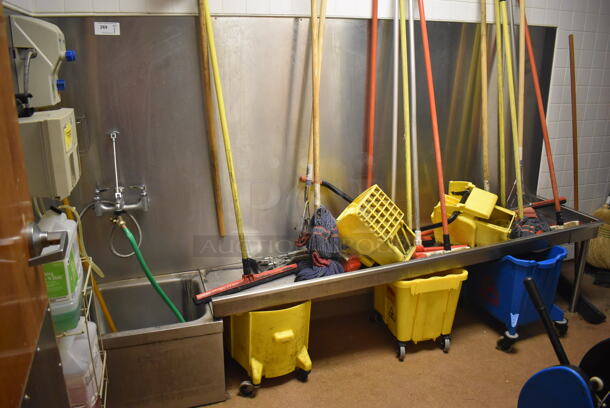 Stainless Steel Commercial Mop Sink w/ Drain Board and Various Mops. BUYER MUST REMOVE. 109x21x64. (Dishroom Closet)