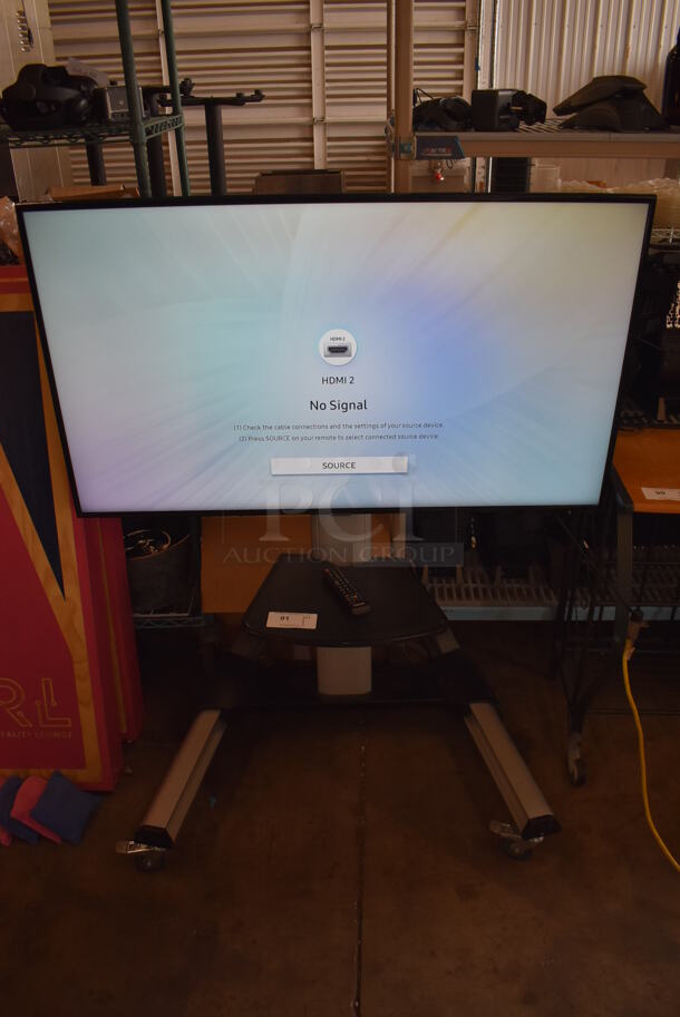 Samsung 50" 4K Smart LED Television on Cart. 120 Volts, 1 Phase. 44x32x55. Buyer Must Pick Up - We Will Not Ship This Item. Tested and Working!