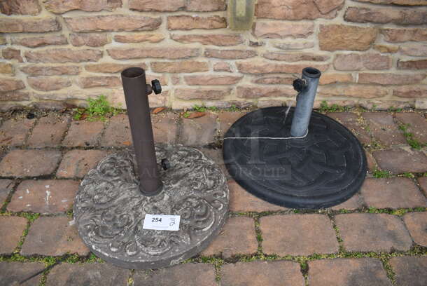 4 Various Metal Patio Umbrella Bases. 4 Times Your Bid! (Patio)