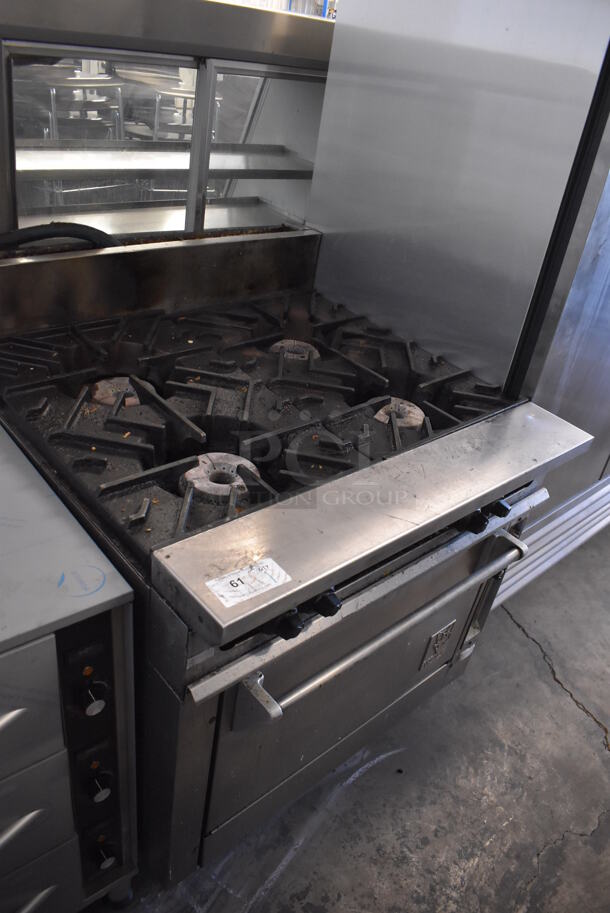 Wolf Stainless Steel Commercial Gas Powered 4 Burner Range w/ Oven on Commercial Casters.