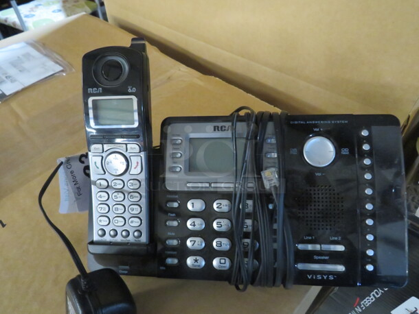 One RCA Cordless Phone/Digital Answering Machine.