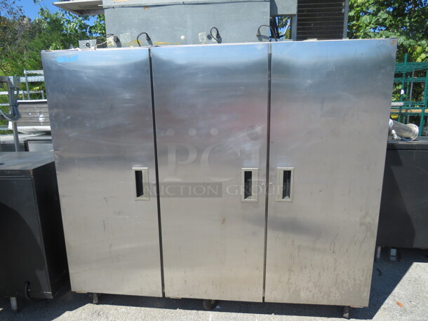 One Delfield 3 Door Refrigerator With 11 Racks On Casters. Working Not Cold. Model# 6076S. 115 Volt. 76X30X80.