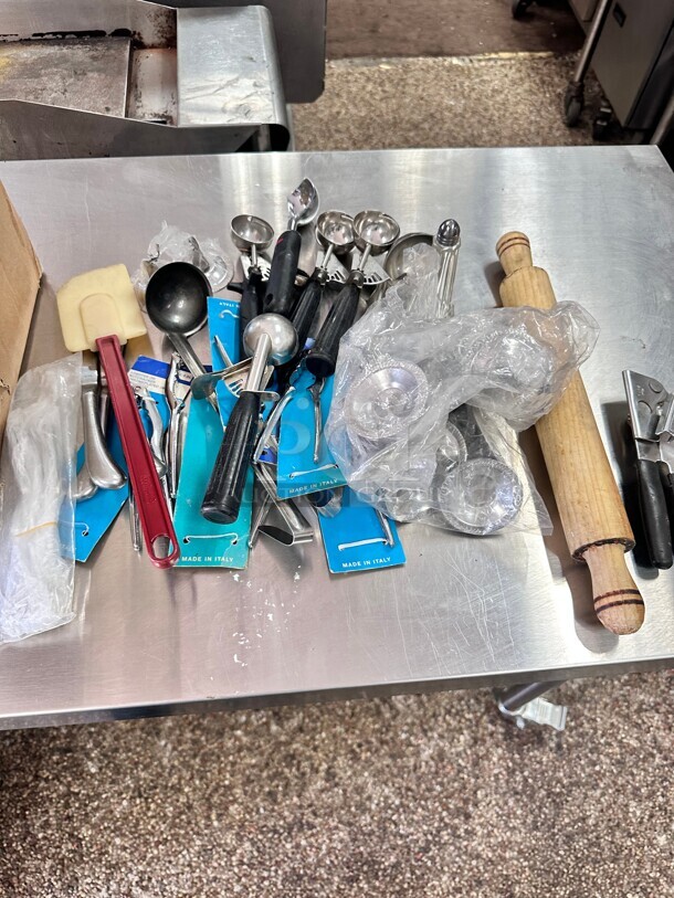 One Lot Of Misc Kitchen Items 
Ice Cream Scooper Table Holders Can Opener etc