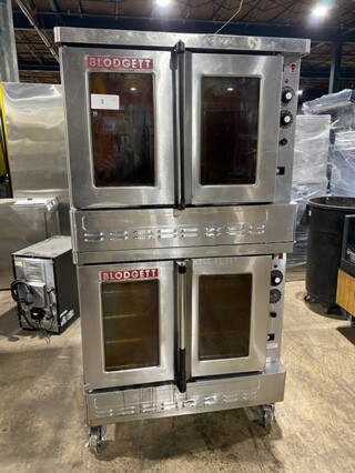 BEAUTIFUL! Blodgett Commercial Natural Gas Powered Double Stacked Convection Oven! With Metal Baking Racks! With View Through Doors! On Commercial Casters! All Stainless Steel! 2 X Your Bid! Makes One Unit!