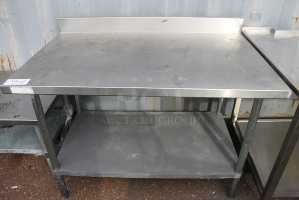 Stainless Steel Table w/ Metal Under Shelf and Back Splash.