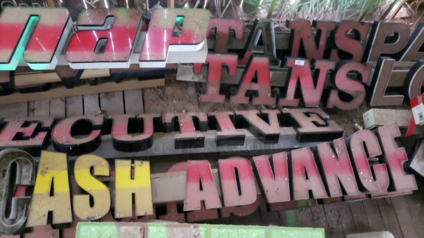 "Cash Advance" Sign. 149". The letter "C" is busted and needs repaired.  Pick up only!  Sold as is (Location 3)