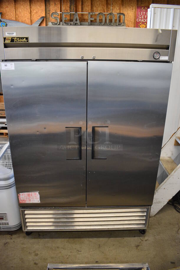 True Model T-49F Stainless Steel Commercial 2 Door Reach In Freezer w/ Poly Coated Racks on Commercial Casters. 115 Volts, 1 Phase. 54x30x83.5. Tested and Powers On But Does Not Get Cold