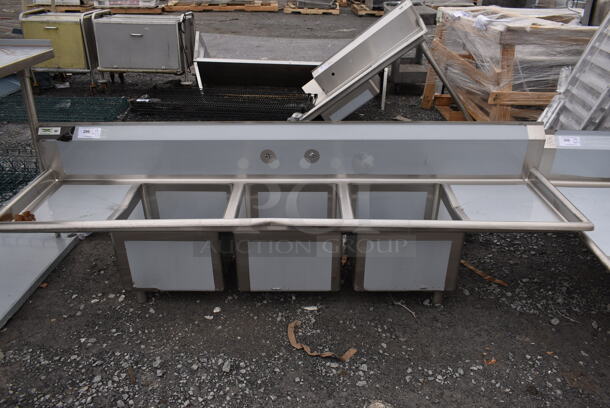 BRAND NEW SCRATCH AND DENT! Regency 600S31717218 Stainless Steel Commercial 3 Bay Sink w/ Dual Drain Boards. No Legs. Bays 17x17. Drain Boards 16.5x18