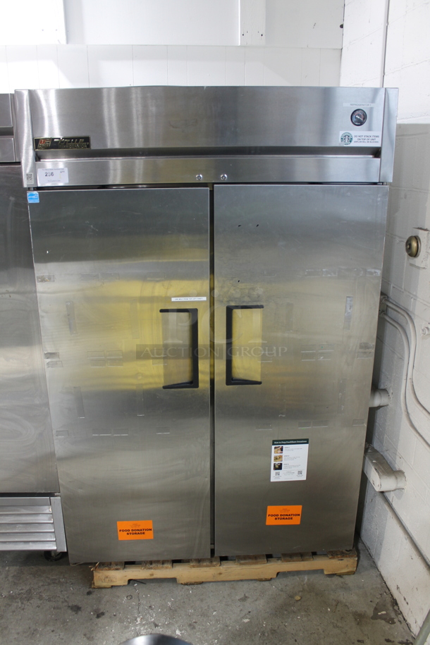 True TG2R-2S Stainless Steel Commercial 2 Door Reach In Cooler w/ Poly Coated Racks. Comes w/ Commercial Casters. 115 Volts, 1 Phase. Tested and Working!