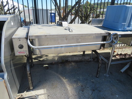 One Groen 40 Gallon Tilt Braising Pan. Model# FPC-4.  57X38X42