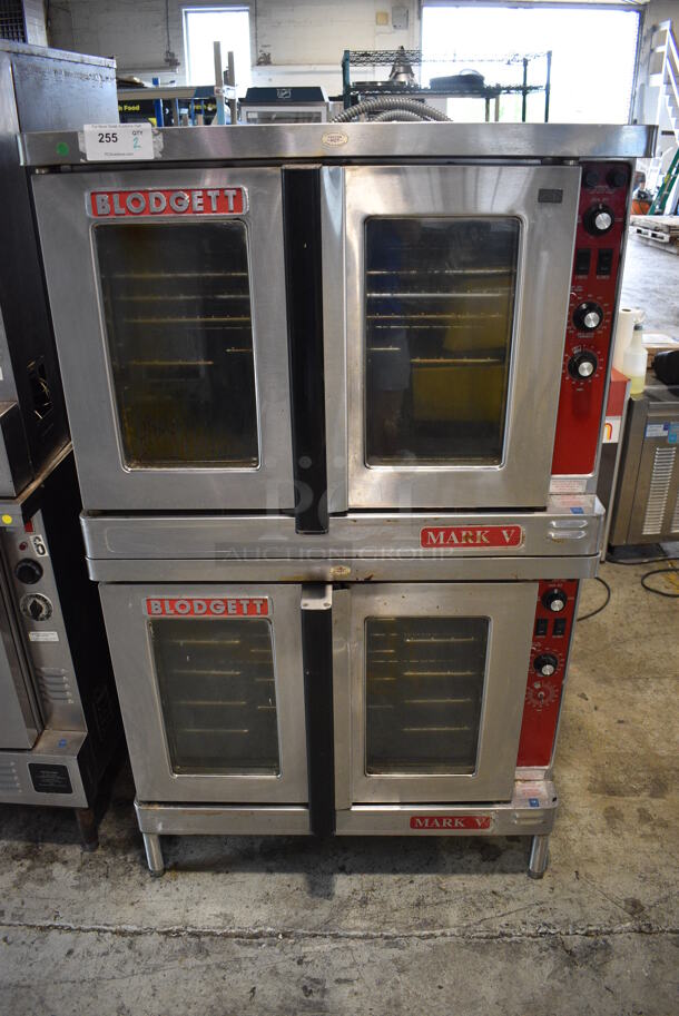 2 Blodgett Mark V Stainless Steel Commercial Electric Powered Full Size Convection Ovens w/ View Through Doors, Metal Oven Racks and Thermostatic Controls. 208-240 Volts, 1 Phase. 38x40x64.5. 2 Times Your Bid!