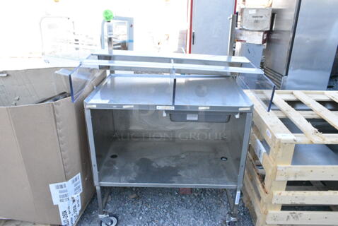 Stainless Steel Portable Table on Commercial Casters. 