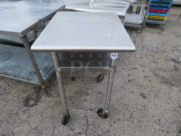 One Stainless Steel Table With Stainless Steel  Under Shelf On Casters. 30X24X35