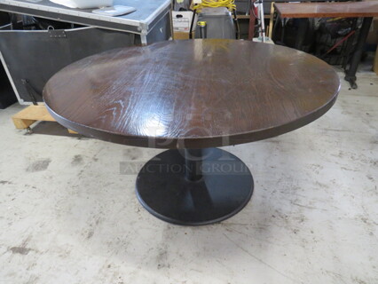 One 1.5 Inch Thick Solid Wood Round Table On A  Pedestal Base. 52X30.