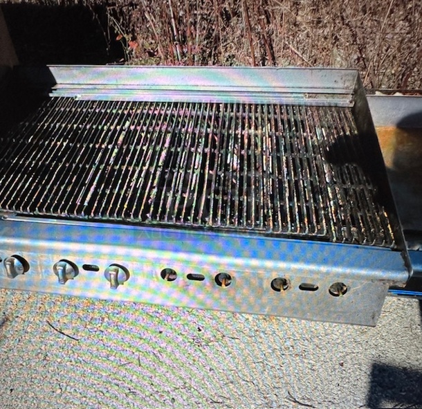 One Natural Gas Charbroiler. Missing 4 Knobs. 48X32X18