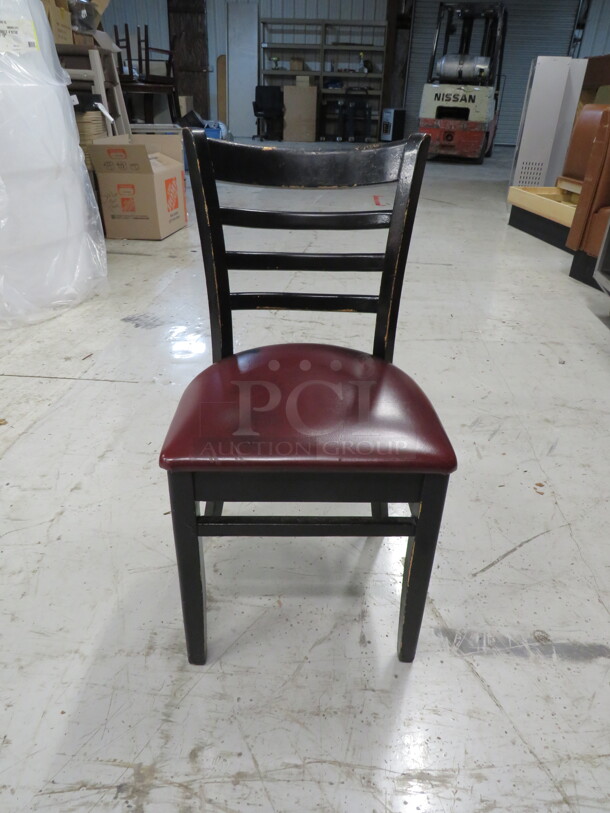 Black Wooden Chair With A Red Cushioned Seat. 4XBID