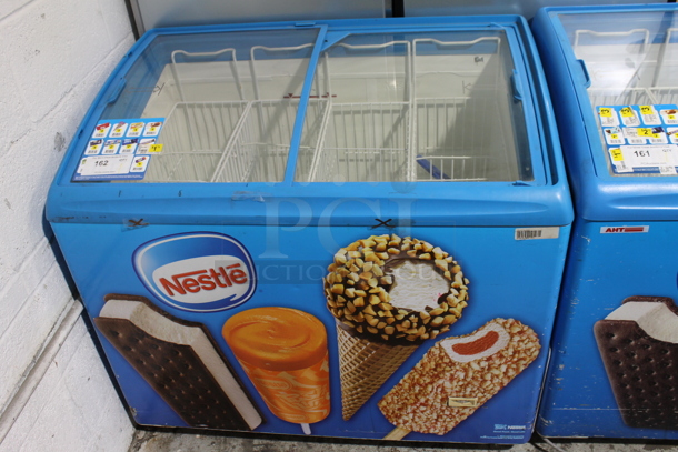 AHT RIO S 100 Metal Commercial Novelty Ice Cream Treat Freezer Merchandiser w/ Poly Baskets on Commercial Casters. 110-120 Volts, 1 Phase. Tested and Working!