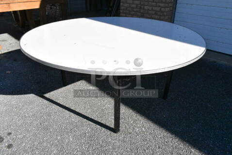 7 Round Folding Table. 7 Times Your Bid! 