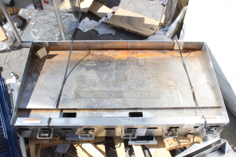 BRAND NEW SCRATCH & DENT! Wolf by Vulcan AGM60-NAT Natural Gas 60" Heavy-Duty Gas Countertop Griddle with Manual Controls - 135,000 BTU. Unit has surface rust and very minor denting. 