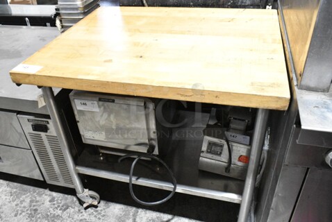 Butcher Block Table w/ Metal Under Shelf on Commercial Casters. Does Not Include Contents. 