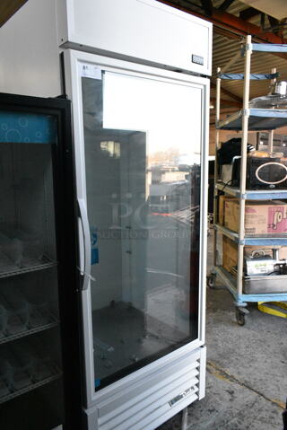 2020 True TSCI-600R-G-PH Metal Commercial Single Door Reach In Cooler Merchandiser. 115 Volts, 1 Phase.