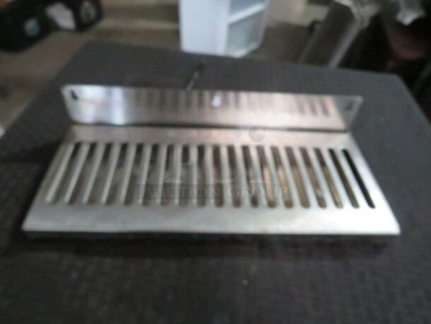 One Stainless Steel Drain. 14X6X3
