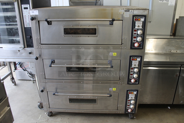Stainless Steel Commercial Electric Powered Triple Deck Bakery Oven Pizza Oven on Commercial Casters. 220 Volts, 1/3 Phase.