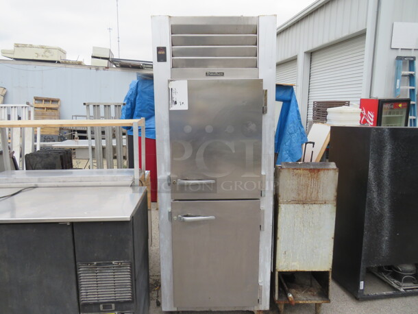 One SS Dutch Door Traulsen Freezer With 3 Racks On Casters. 115 Volt. #G12000. Working Not Cold. 29X36X81.5