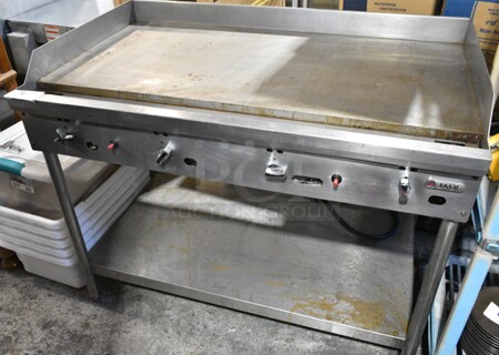 Jade Range JGT-2448-F Stainless Steel Commercial Natural Gas Powered Flat Top Griddle w/ Metal Under Shelf. 24,000 BTU. 