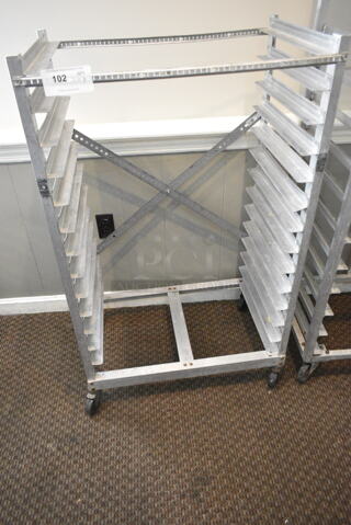 Metal Commercial Pan Transport Rack on Commercial Casters. (secondary dining room)