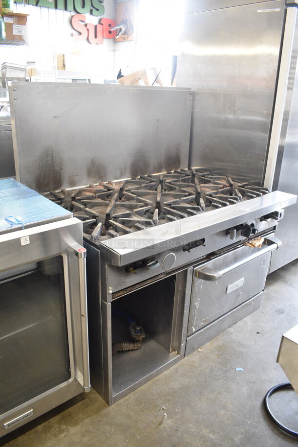 Garland Stainless Steel Commercial Natural Gas Powered 8 Burner Range w/ Convection Oven, Back Splash and Commercial Casters. Oven Door Does Not Stay Closed. 