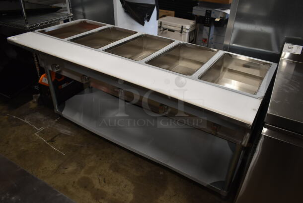 BRAND NEW SCRATCH AND DENT! 2022 ServIt 423GST5WENG Stainless Steel Commercial Floor Style Natural Gas Powered 5 Well Steam Table w/ Under Shelf. 