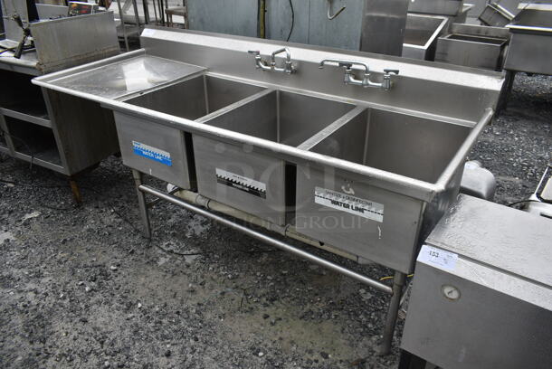 Stainless Steel Commercial 3 Bay Sink w/ Left Side Drain Board, 2 Faucets and 2 Handle Sets. Bays 20x28. Drain Boards 22x31