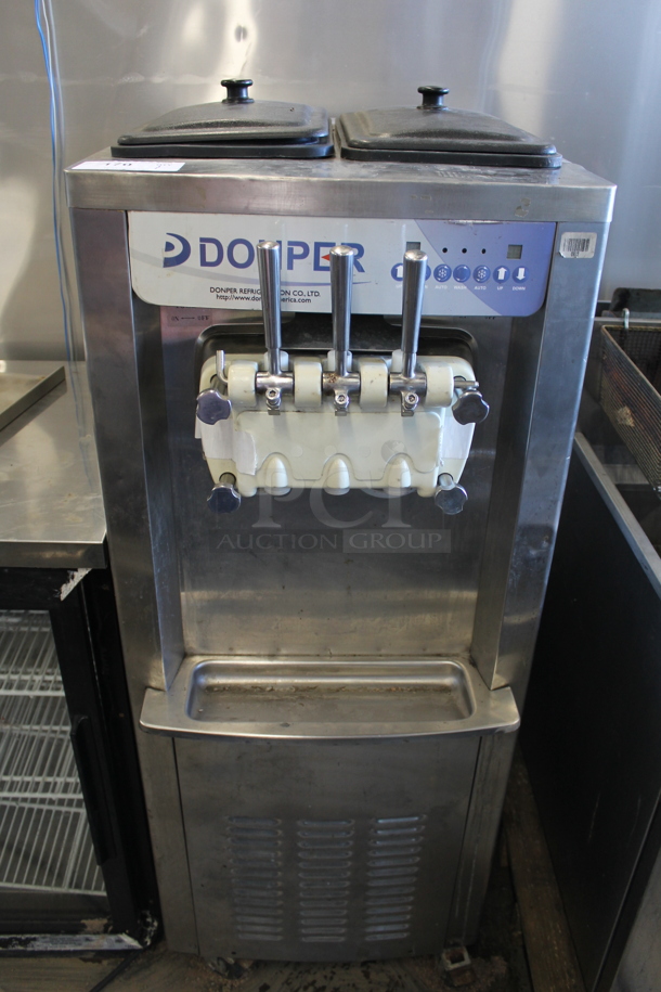 Donper Stainless Steel Commercial Floor Style Air Cooled 2 Flavor w/ Twist Soft Serve Ice Cream Machine on Commercial Casters. 208-250 Volts, 1 Phase.
