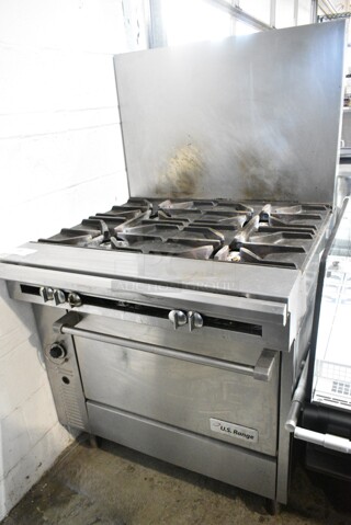 US Range C836-7 Stainless Steel Commercial Natural Gas Powered 4 Burner Range w/ Oven and Back Splash on Commercial Casters. 